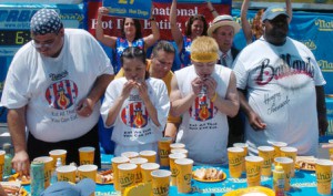 Jul 04, 2005; New York, NY, USA; Competitive eaters L to R: Ed "Cookie" Jarvis, Sonya Thomas, TAKERU KOBAYASHI, and Eric "Badlands" Booker during Nathan's Famous Fourth of July International Hot Dog Eating Contest at Coney Island. TAKERU KOBAYASHI, of Nagano, Japan won after eating 49 hot dogs in 12 minutes.